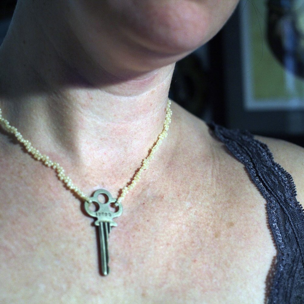 Bead necklace with key